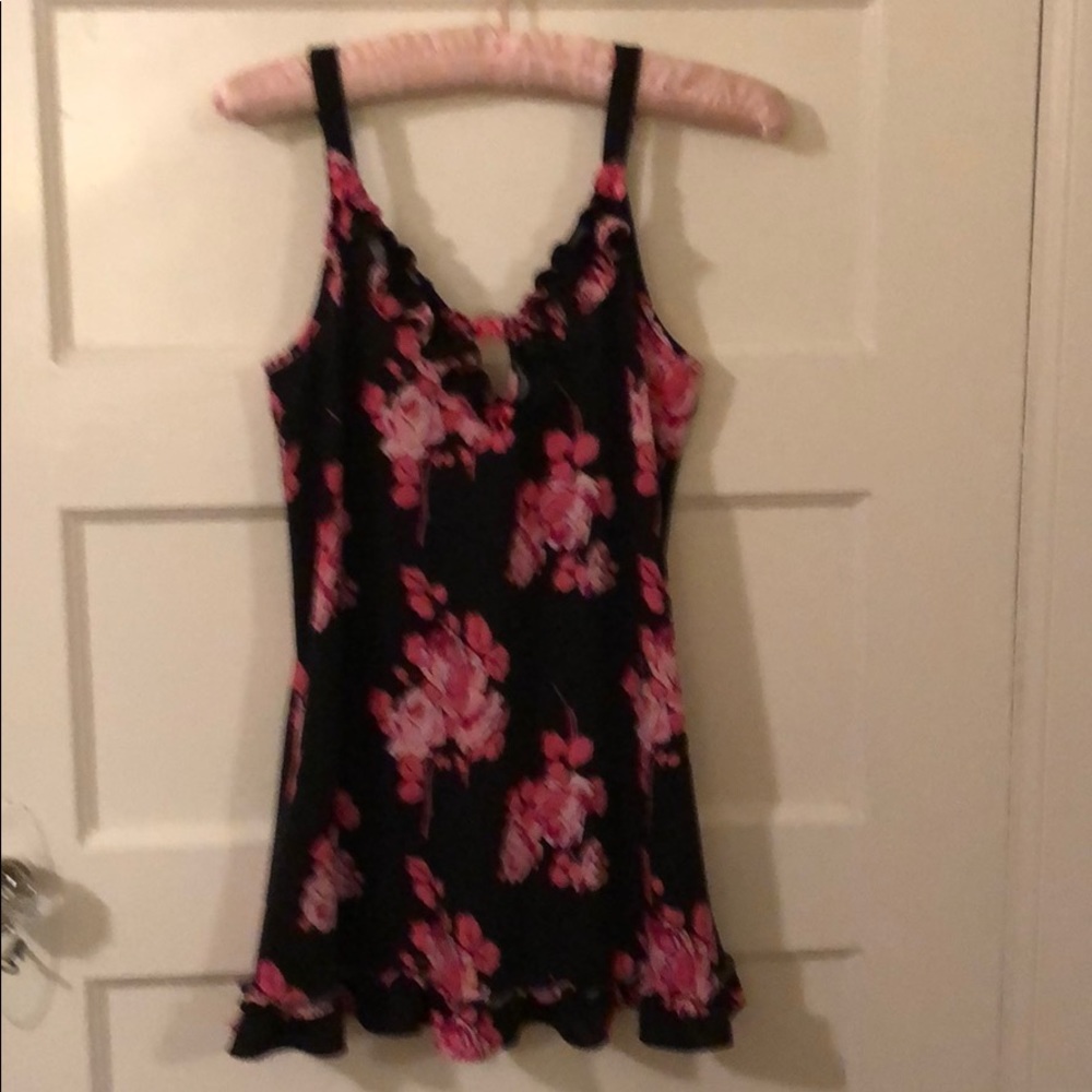Babydoll nighty w adjustable straps w back tie .